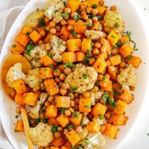 Roasted Squash, Cauliflower and Chickpeas that are perfectly seasoned and cooked all on one sheet pan for an easy and delicious healthy side dish the whole family will love!