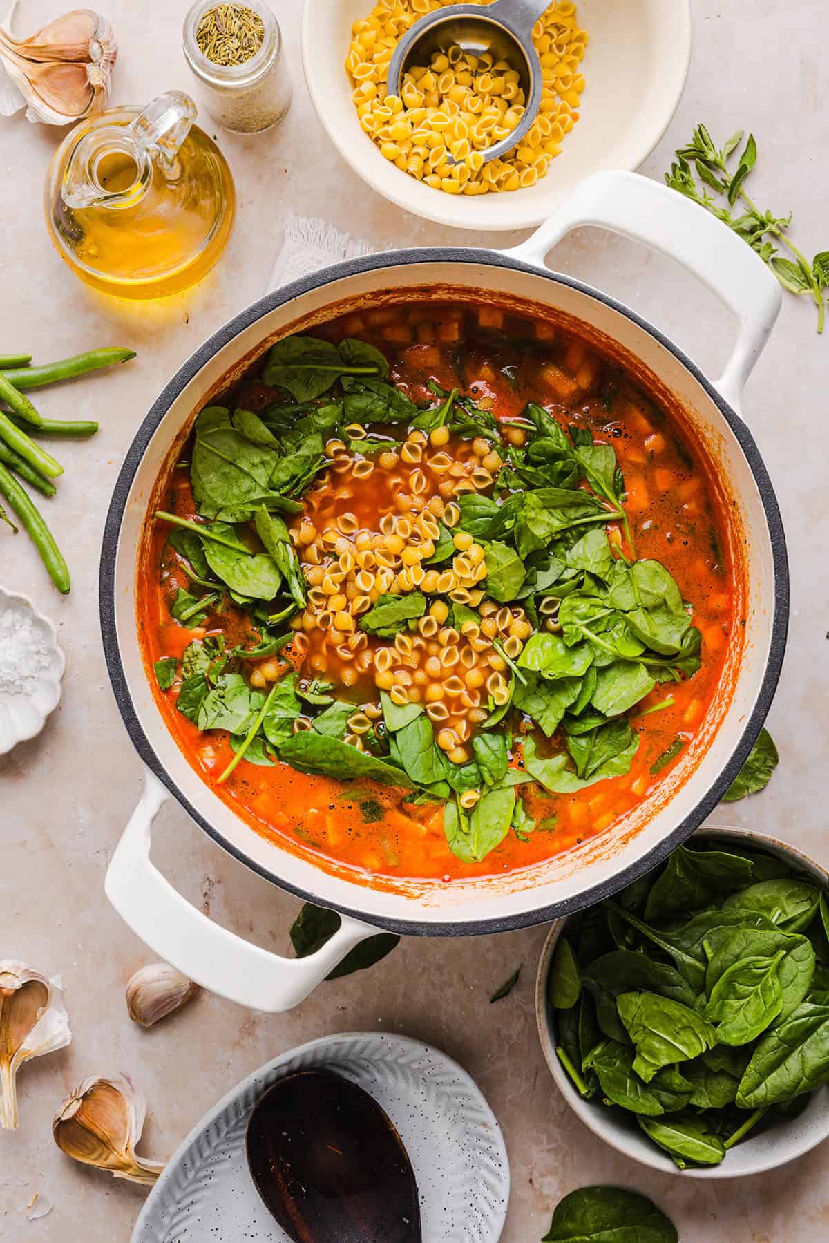 Easy and delicious Olive Garden Minestrone Soup loaded with fresh veggies, leafy greens and simmered in the most flavorful broth! Easily made in one pot for a cozy weeknight dinner the whole family will love!