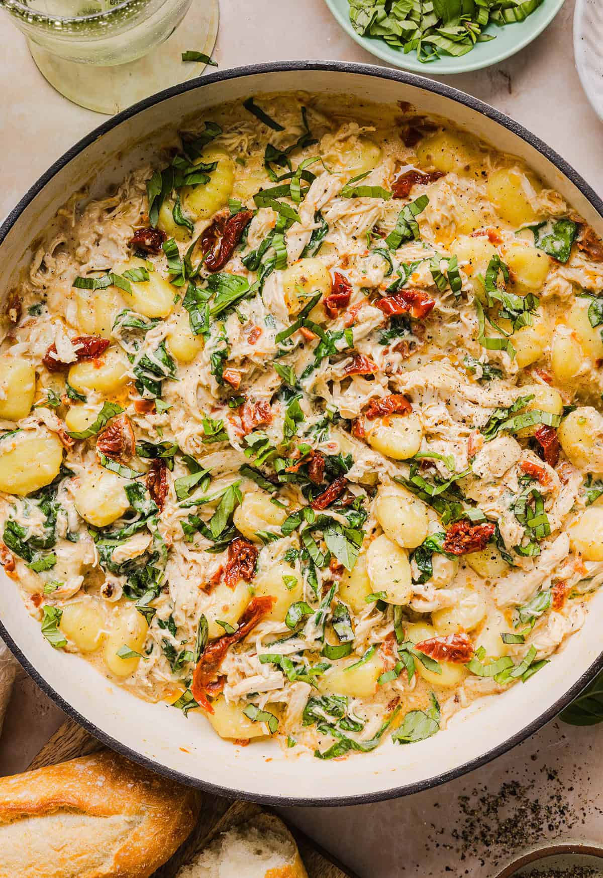 This EASY One Pan Marry Me Chicken and Gnocchi is the perfect weeknight meal! Pillowy soft gnocchi and tender chicken simmered together in a creamy sun dried tomato and parmesan sauce in just 20 minutes!  