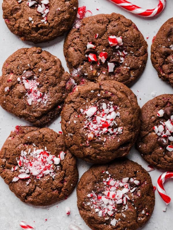 These chewy Chocolate Chip Peppermint Cookies are rich and fudgy with a festive candy cane crunch that are so easy to make! The perfect holiday cookie made healthier with less butter, whole wheat flour and zero refined sugar.