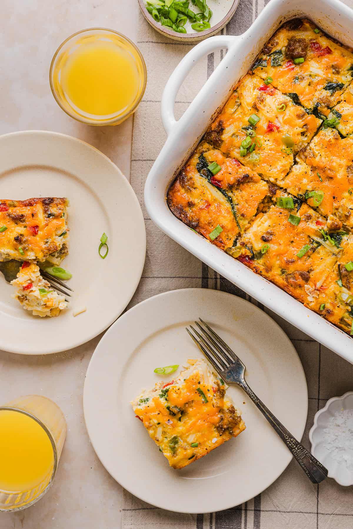 This Easy Hash Brown Breakfast Casserole is loaded with savory sausage, sautéed peppers and onions, along with melty cheese and perfectly seasoned eggs. The perfect recipe for your holiday brunch or weekend breakfast that can easily be prepped the night before!