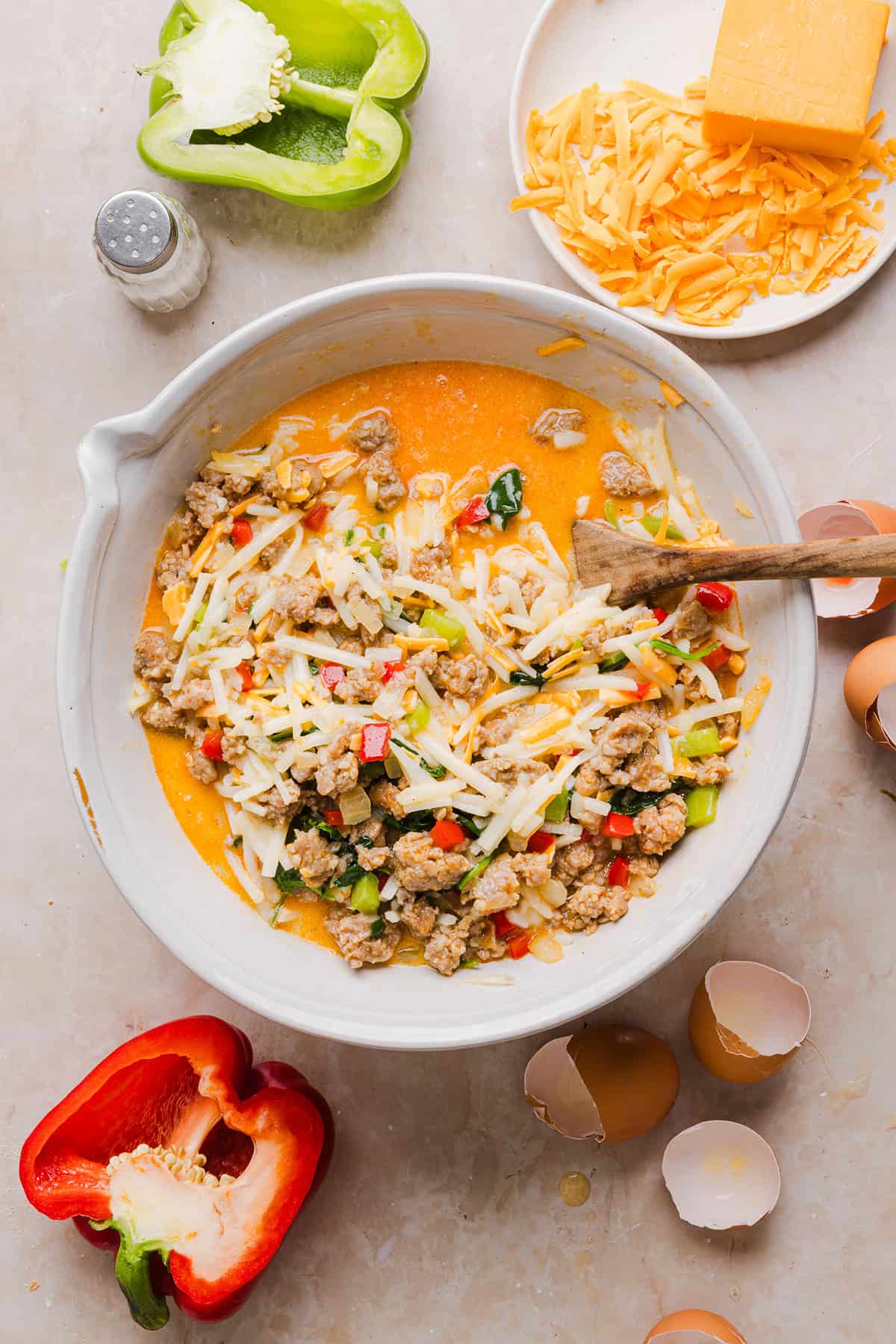 This Easy Hash Brown Breakfast Casserole is loaded with savory sausage, sautéed peppers and onions, along with melty cheese and perfectly seasoned eggs. The perfect recipe for your holiday brunch or weekend breakfast that can easily be prepped the night before!