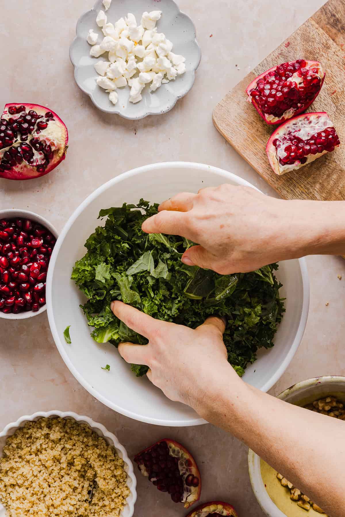 This Winter Kale and Quinoa Salad is a vibrant, wholesome salad that is bursting with flavor! Made with leafy kale, tender quinoa, juicy pomegranate seeds and crunchy walnuts all tossed together with a light dijon vinaigrette for the perfect holiday side dish!