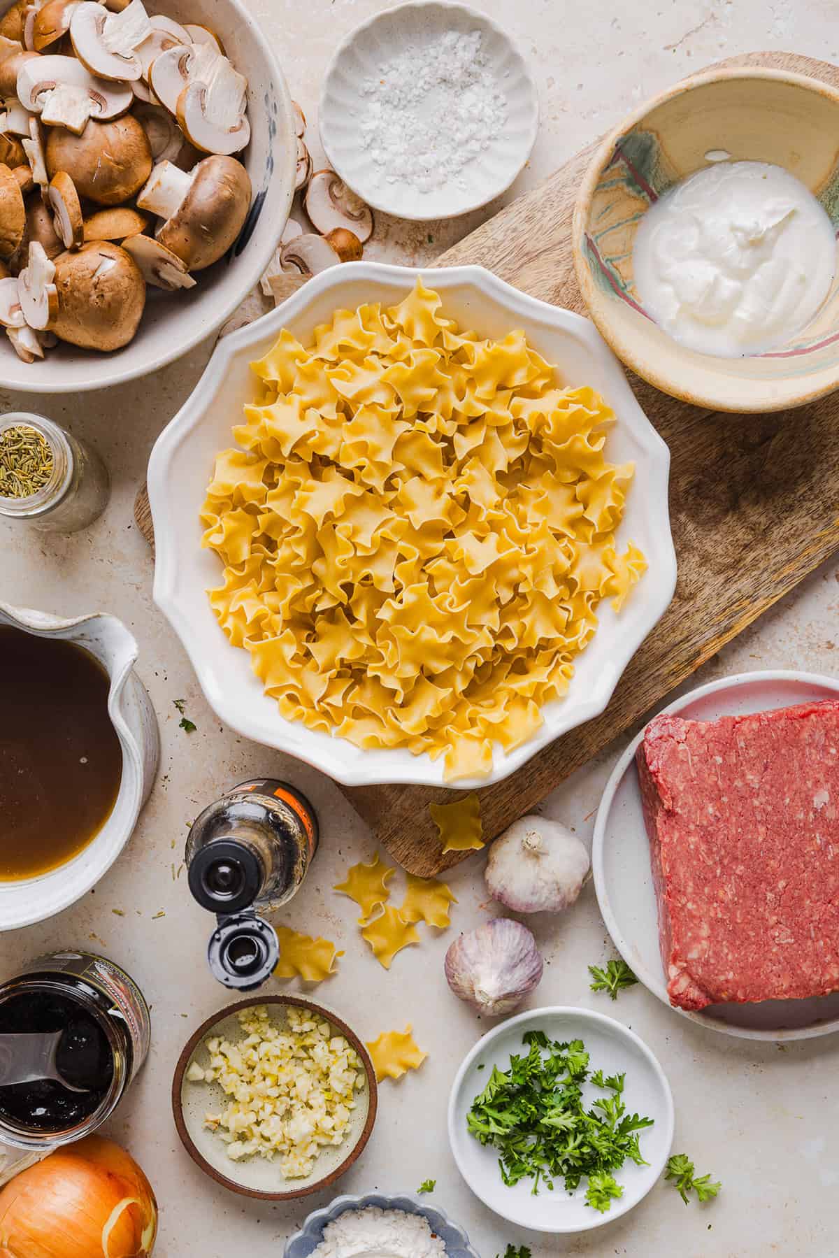 This Healthy Ground Beef Stroganoff Casserole is the ultimate family-friendly comfort food! The perfect cozy weeknight meal made with egg noodles and smothered in the most delicious creamy mushroom sauce in just 30 minutes!