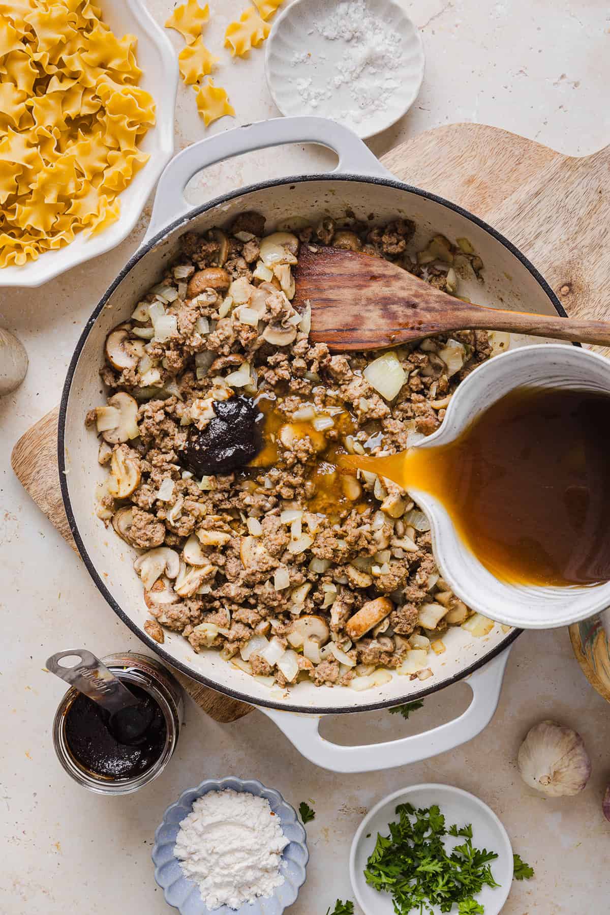 This Healthy Ground Beef Stroganoff Casserole is the ultimate family-friendly comfort food! The perfect cozy weeknight meal made with egg noodles and smothered in the most delicious creamy mushroom sauce in just 30 minutes!