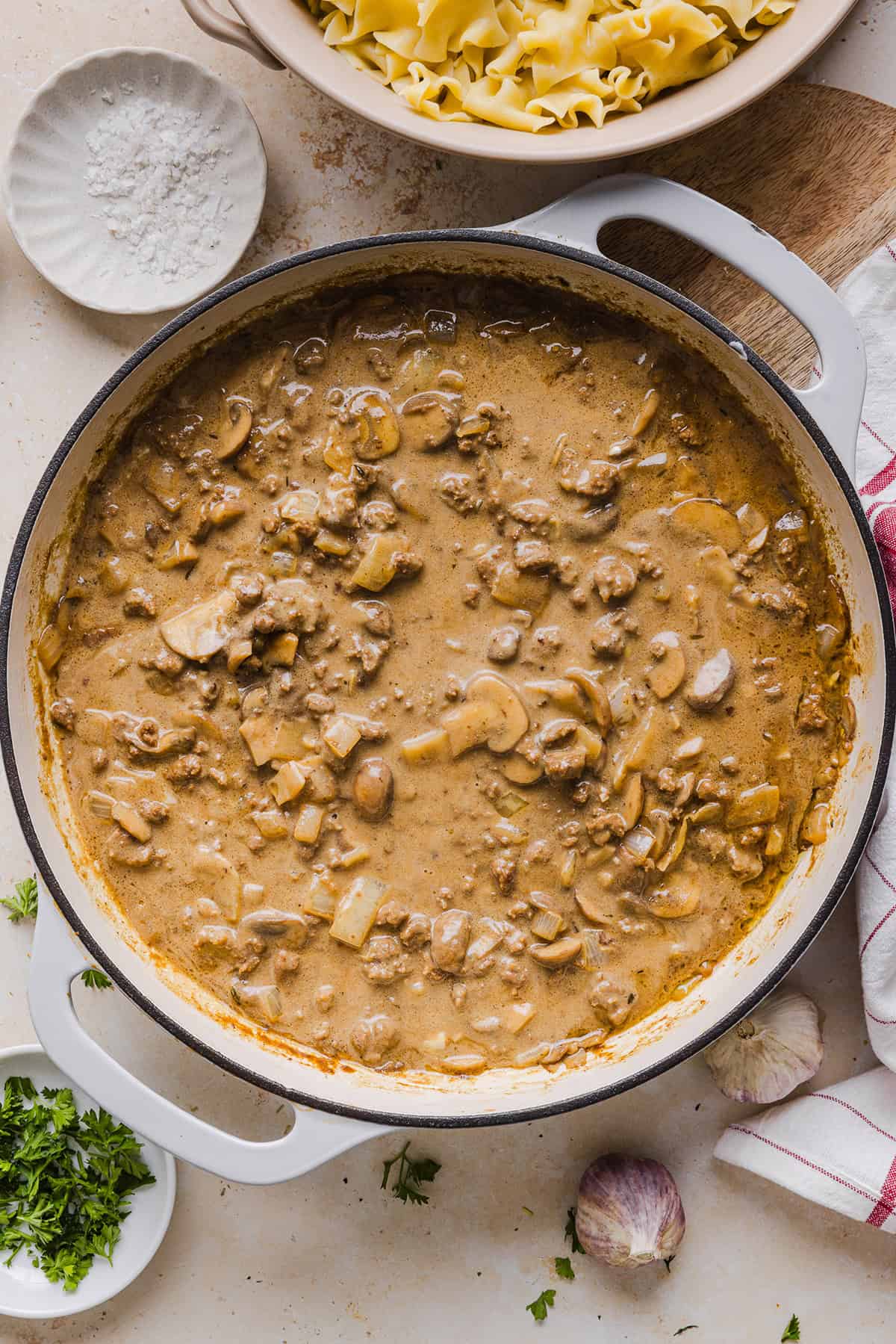 This Healthy Ground Beef Stroganoff Casserole is the ultimate family-friendly comfort food! The perfect cozy weeknight meal made with egg noodles and smothered in the most delicious creamy mushroom sauce in just 30 minutes!