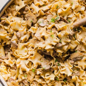 This Healthy Ground Beef Stroganoff Casserole is the ultimate family-friendly comfort food! The perfect cozy weeknight meal made with egg noodles and smothered in the most delicious creamy mushroom sauce in just 30 minutes!