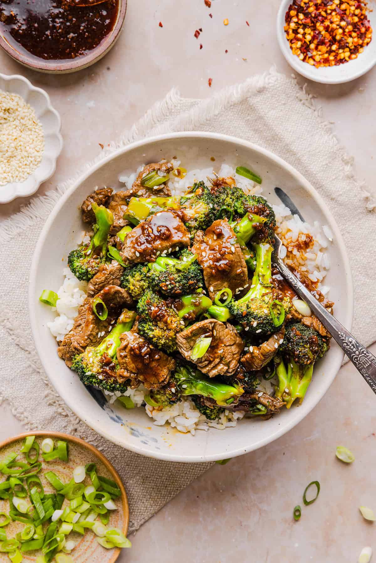 You'll love this Healthy Beef and Broccoli recipe made with tender flank steak, crisp broccoli and a savory garlic ginger sauce. A quick and easy weeknight dinner that tastes better than take-out and comes together in under 30 minutes!