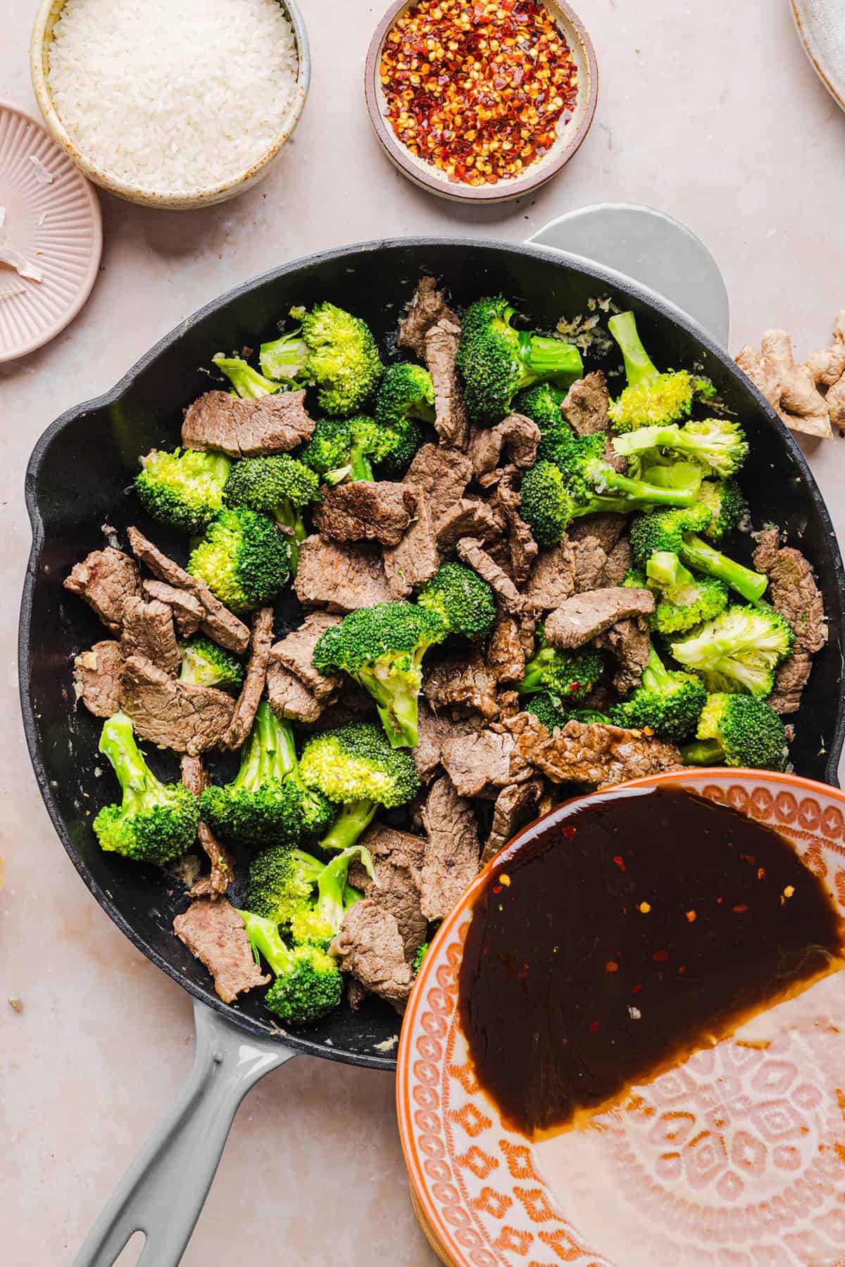 You'll love this Healthy Beef and Broccoli recipe made with tender flank steak, crisp broccoli and a savory garlic ginger sauce. A quick and easy weeknight dinner that tastes better than take-out and comes together in under 30 minutes!