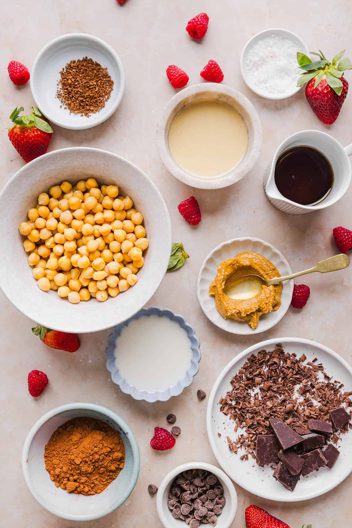 This Healthy Chocolate Hummus is rich and indulgent to satisfy your sweet tooth, but made with wholesome ingredients that you can feel good about eating! Serve with your favorite fruit, pretzels or graham crackers for the perfect fun dessert or snack!