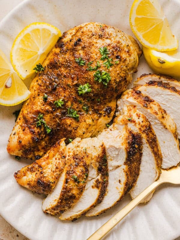 Juicy Air Fryer Chicken Breast recipe that comes out perfectly every time in just 20 minutes! Seasoned with a blend of herbs and spices for a delicious, healthy meal great for busy weeknights or when you need to meal prep.
