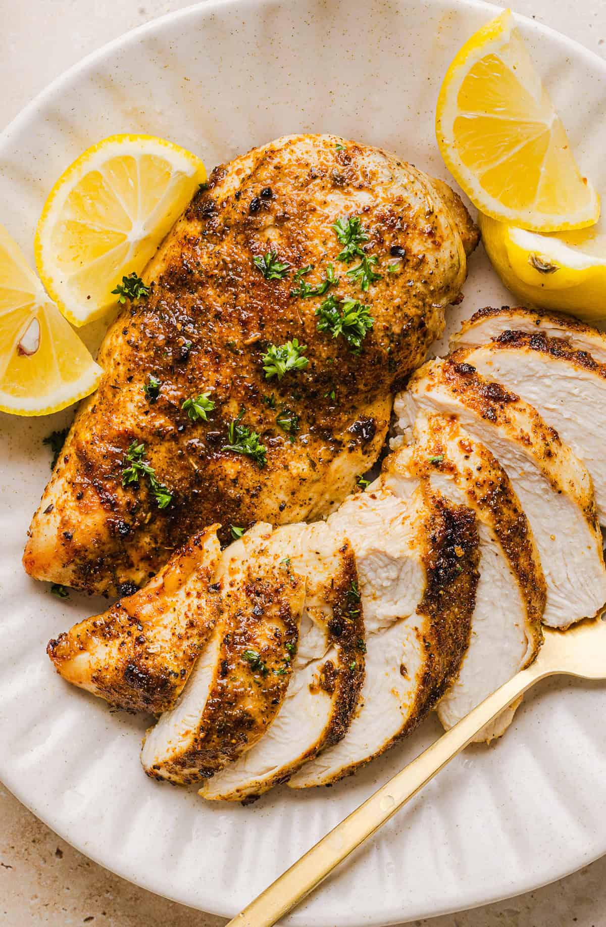 Juicy Air Fryer Chicken Breast recipe that comes out perfectly every time in just 20 minutes! Seasoned with a blend of herbs and spices for a delicious, healthy meal great for busy weeknights or when you need to meal prep.