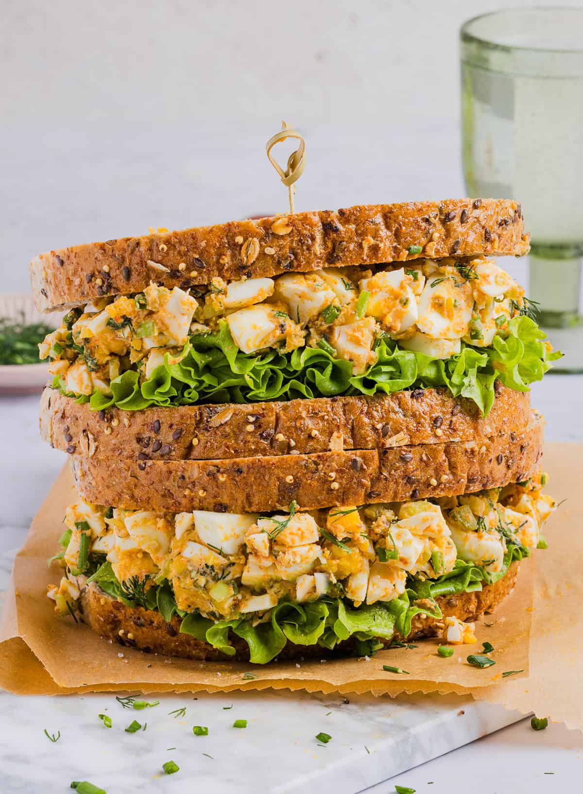 This Healthy Egg Salad Sandwich is a lighter take on the classic, made with Greek yogurt, crisp veggies, and fresh herbs for a fresh, flavorful bite. Pile it generously onto hearty whole grain bread with layers of lettuce, tomato or even avocado for a satisfying, protein-packed lunch that's a delicious way to use up leftover hard-boiled eggs.