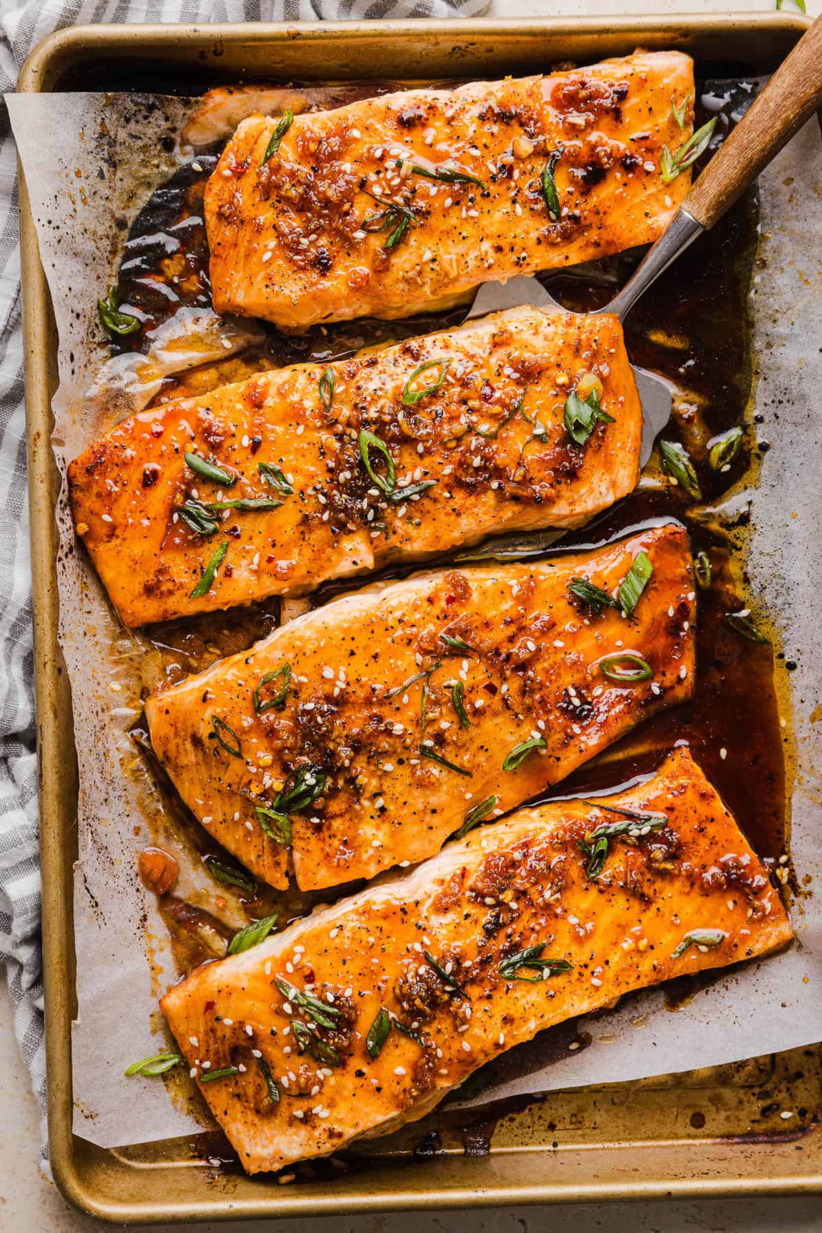 The most flavorful Hot Honey Glazed Salmon that is tender, flaky and coated in a sweet and savory homemade hot honey sauce. This simple healthy recipe easily comes together in under 20 minutes!