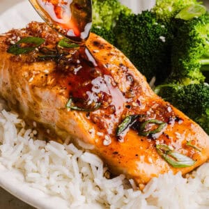 The most flavorful Hot Honey Glazed Salmon that is tender, flaky and coated in a sweet and savory homemade hot honey sauce. This simple healthy recipe easily comes together in under 20 minutes!