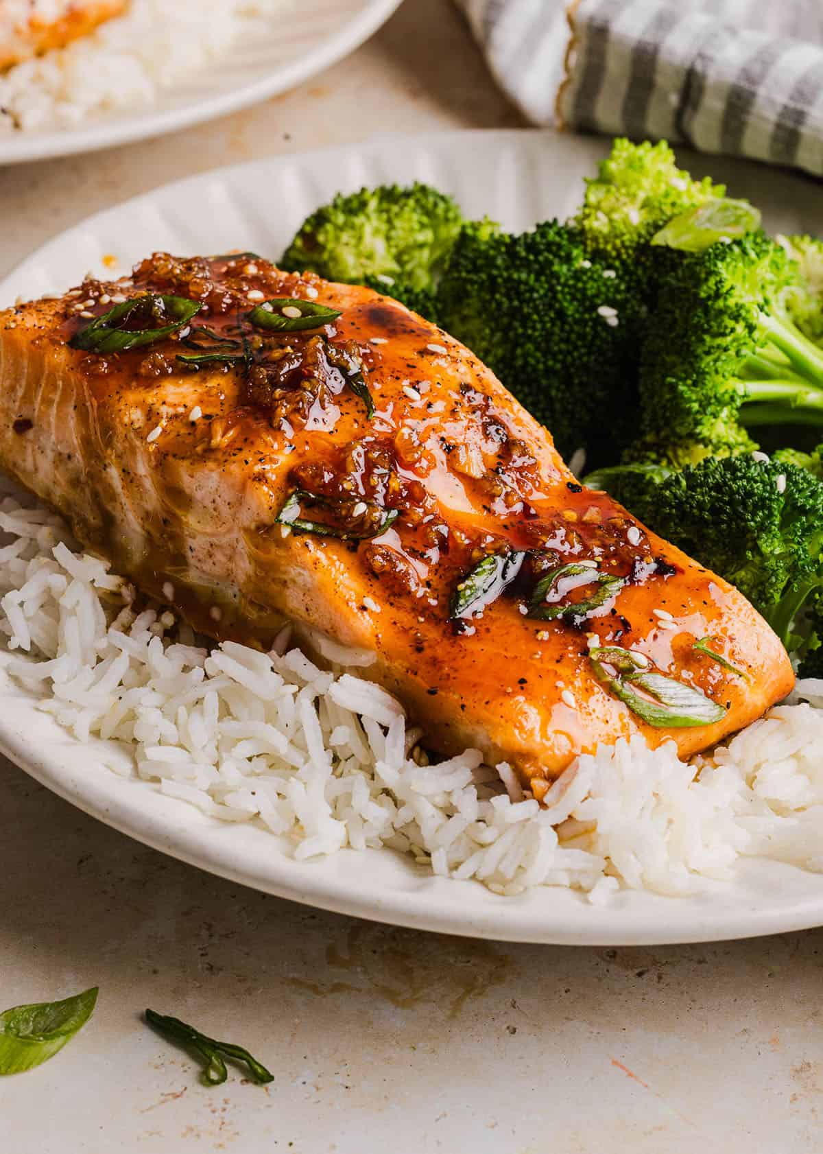 The most flavorful Hot Honey Glazed Salmon that is tender, flaky and coated in a sweet and savory homemade hot honey sauce. This simple healthy recipe easily comes together in under 20 minutes!