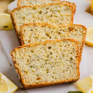 The BEST Healthy Lemon Poppy Seed Bread made with Greek yogurt and honey. Perfectly moist, naturally sweetened, and topped with the most delicious fresh lemon glaze!