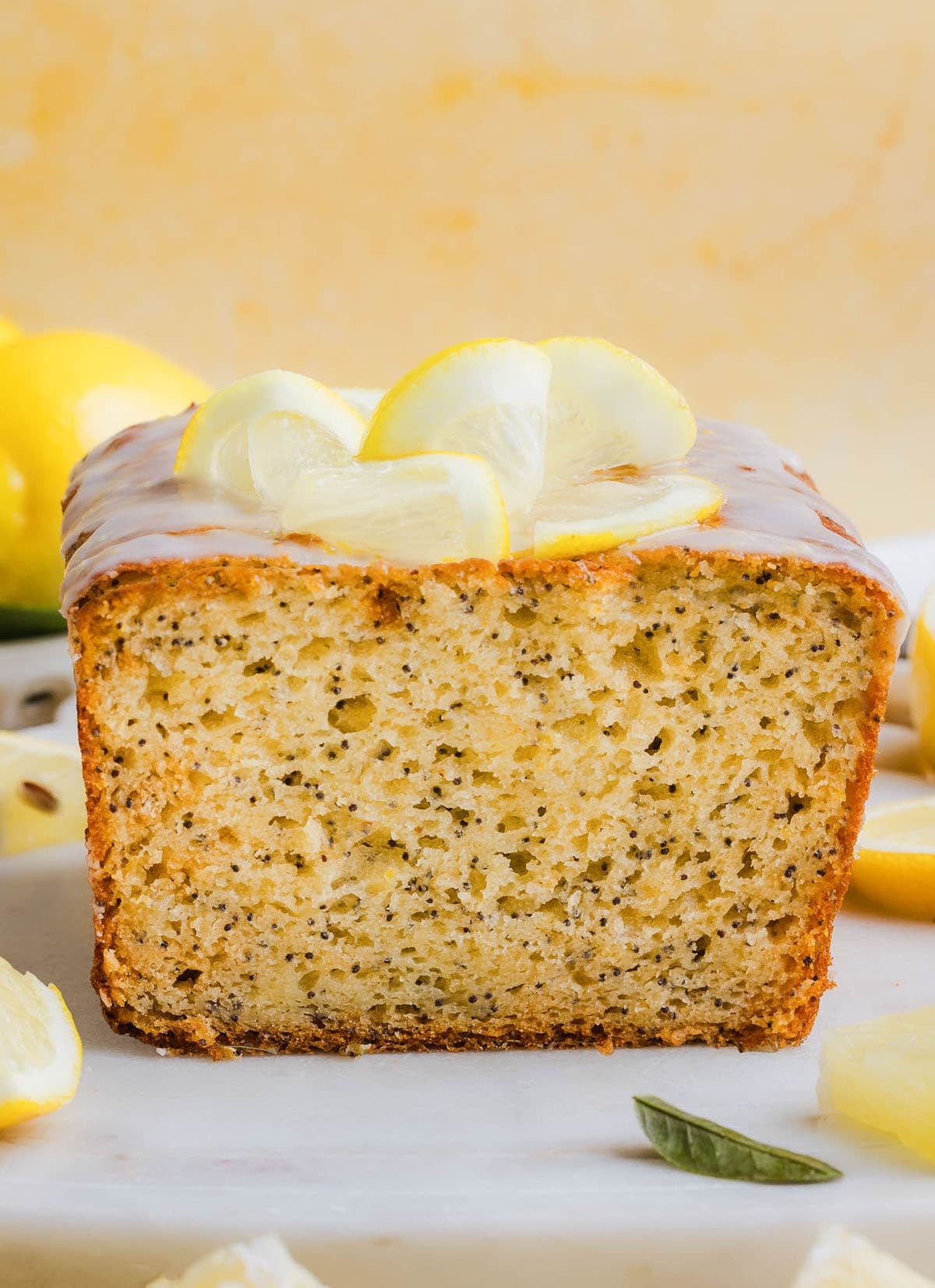 The BEST Healthy Lemon Poppy Seed Bread made with Greek yogurt and honey. Perfectly moist, naturally sweetened, and topped with the most delicious fresh lemon glaze!