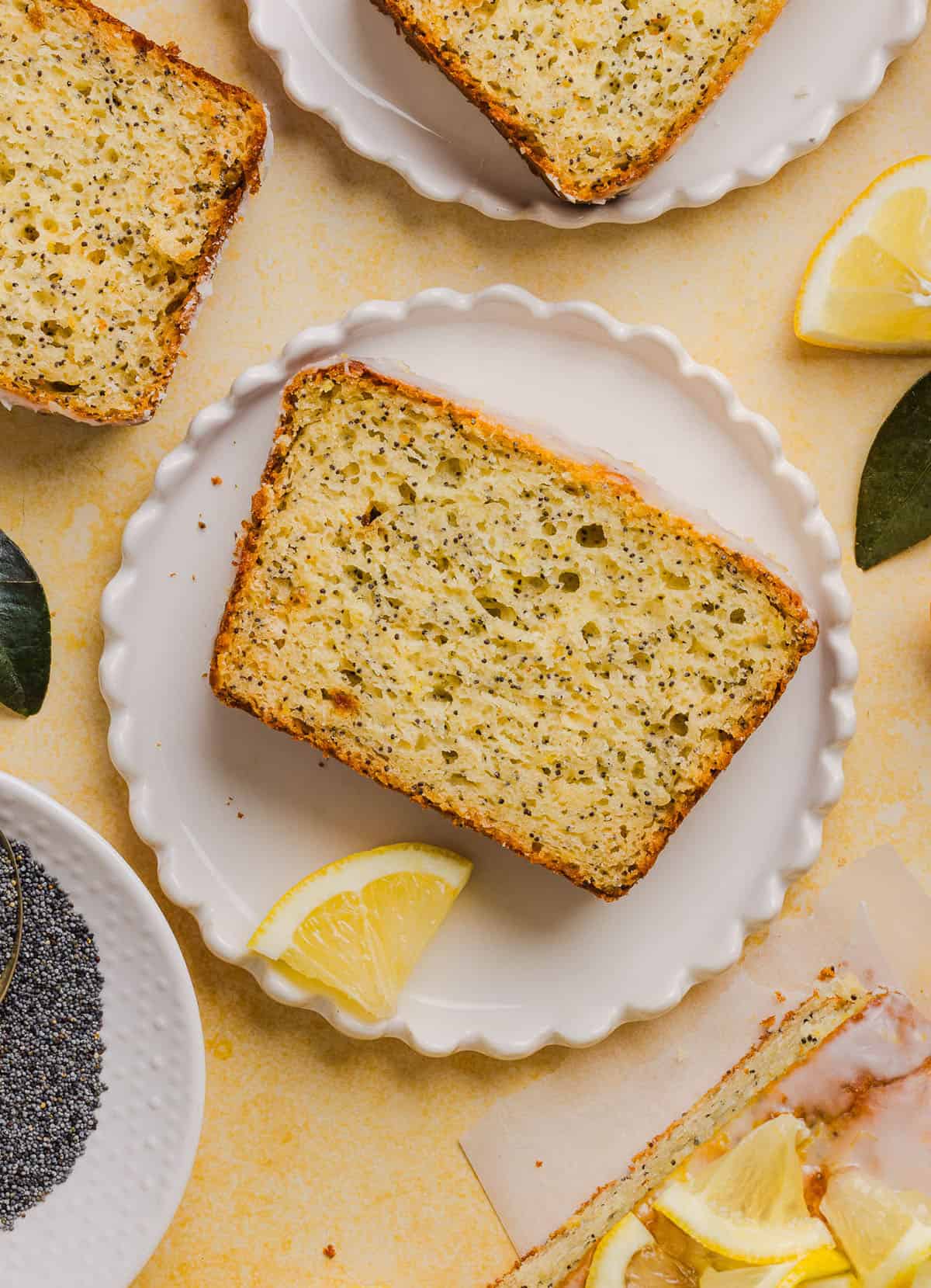 The BEST Healthy Lemon Poppy Seed Bread made with Greek yogurt and honey. Perfectly moist, naturally sweetened, and topped with the most delicious fresh lemon glaze!