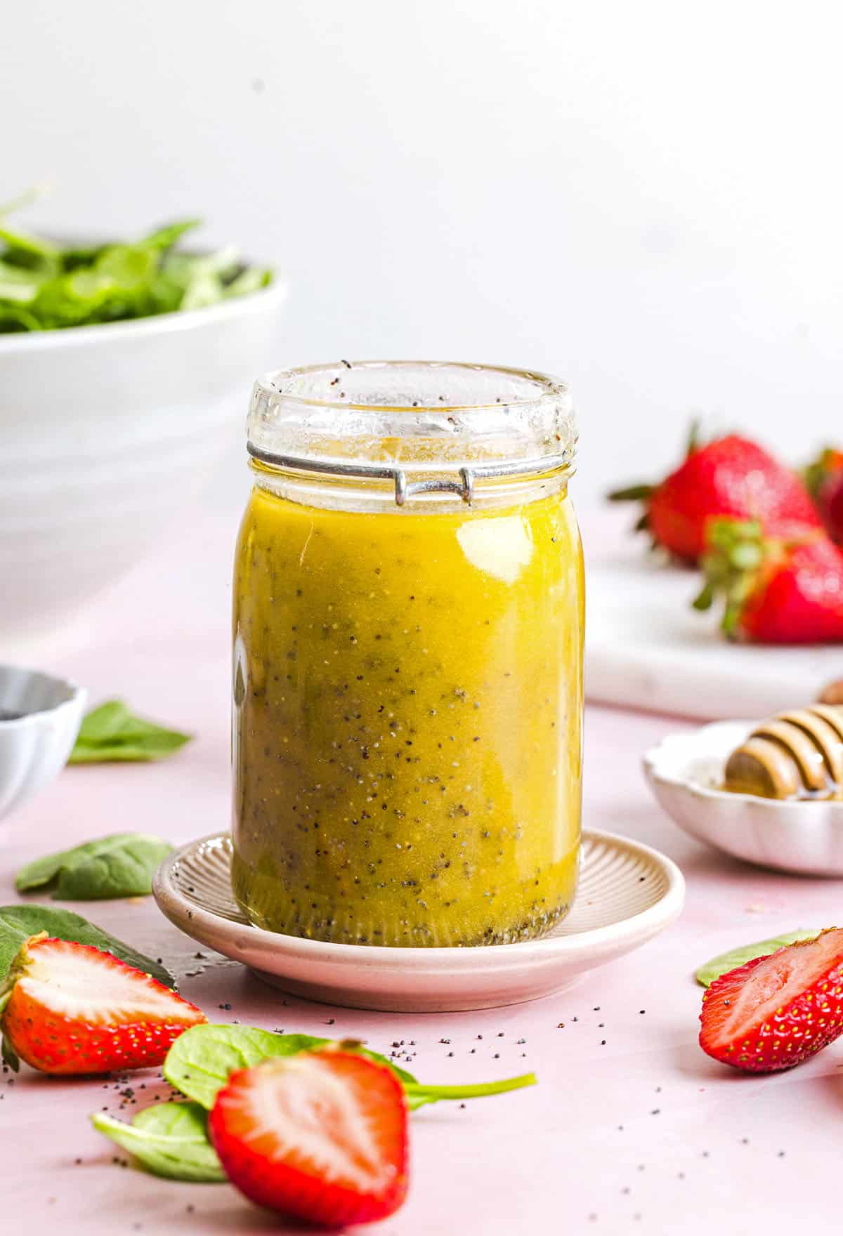 This Poppy Seed Dressing recipe is light, sweet and perfectly tangy made with simple ingredients in just 5 minutes! The perfect addition to fresh salads, fruit, or grilled chicken and tastes so much better than store-bought.
