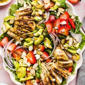 This Strawberry Poppy Seed Chicken Salad is fresh, flavorful, and perfect for spring and summer! Made with juicy strawberries, tender chicken, crunchy toppings, and the BEST poppy seed dressing.