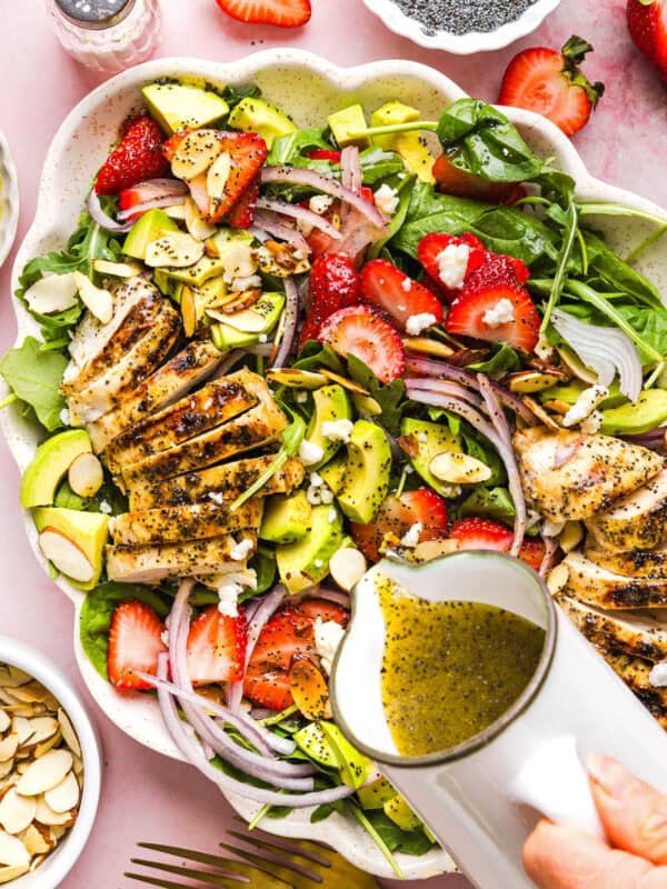 This Strawberry Poppy Seed Chicken Salad is fresh, flavorful, and perfect for spring and summer! Made with juicy strawberries, tender chicken, crunchy toppings, and the BEST poppy seed dressing.